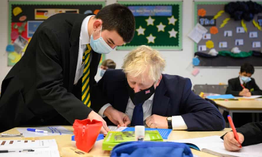Boris Johnson speaks with pupils in a maths class as he makes a constituency visit to Oakwood School in Uxbridge, England