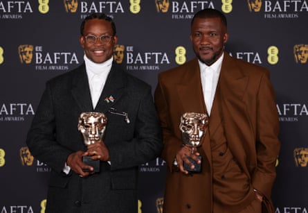 My Father’s Shadow writers Akinola Davies Jr, left, and brother Wale Davies with their trophies for outstanding debut by British writer, director or producer.