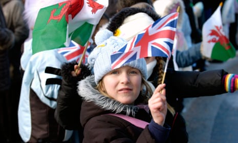Welsh children waving flags at the opening of the National Assembly for Wales.