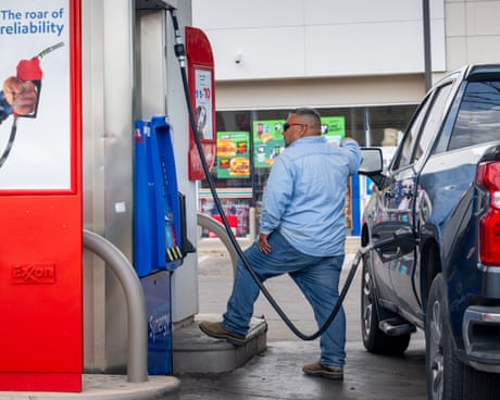 a person pumps gas