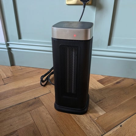 A Russell Hobbs oscillating ceramic 2kW heater on a wooden floor