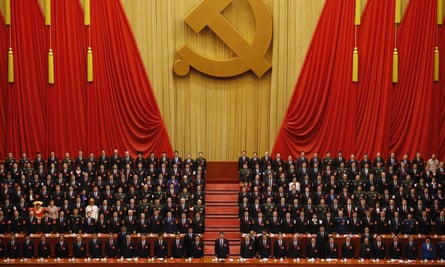 China’s president, Xi Jinping, stands with delegates during the closing ceremony of the 19th party congress in Beijing.