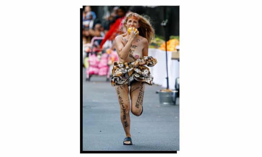A model runs while eating an orange during the Collina Strada SS20 show in New York.