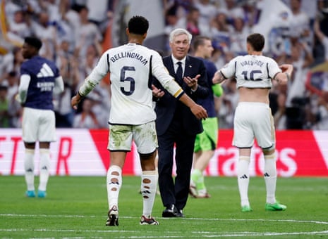 Real Madrid coach Carlo Ancelotti and Jude Bellingham celebrate after the match.