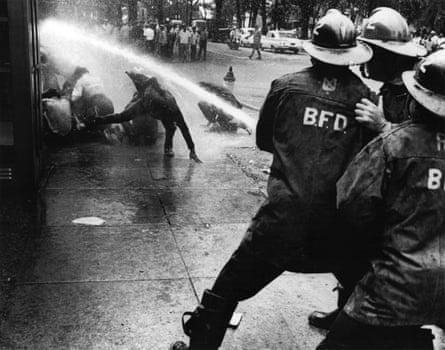 Firefighters turn their hoses full force on civil rights demonstrators July 15, 1963 in Birmingham, Alabama.
