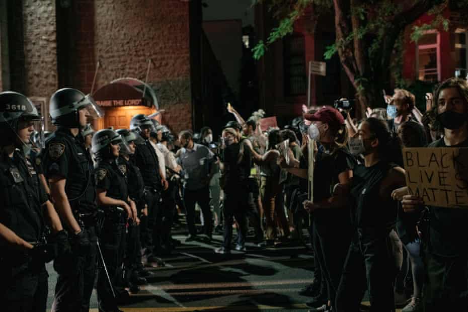 Protesters speaking out against systemic racism in law enforcement clash with a line of NYPD agents, June 4, 2020.