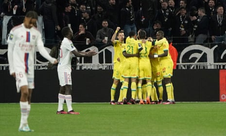 Nantes players celebrate after they take a 1-0 lead at Lyon.