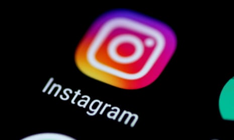 The Instagram app icon is seen on a phone screen