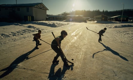 Boys play an impromptu game of hockey in a Fort McMurray street