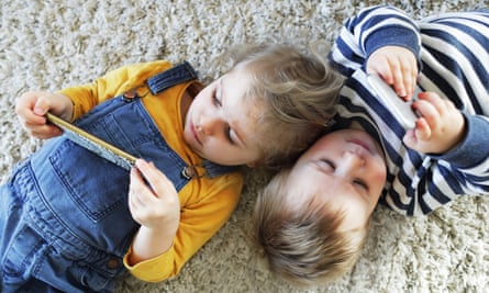 Two small children with phones
