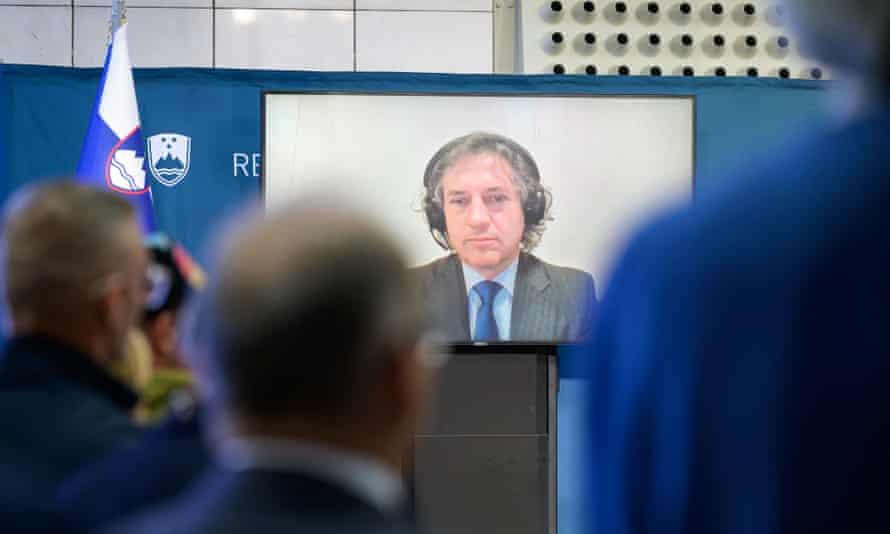 Robert Golob, on screen via videocall due to isolating with Covid, delivers a speech after the general election in Ljubljana on Sunday.