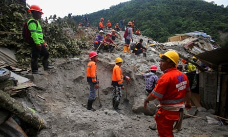 Rescuers used their hands and shovels to search for survivors and bodies in the wreckage