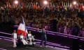 French athletes and a flag-bearer during the parade in the stadium.