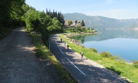 Cyclists on coastal road on the Balkans trilogy tour.