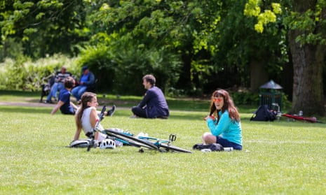  People enjoying warm weather in Finsbury park as they observe social distancing,17 May 2020