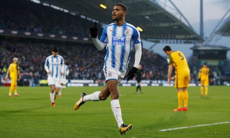 Steve Mounie celebrates scoring Huddersfield’s second goal against Brighton.