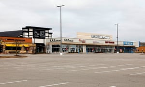 A shopping center with closed retail stores due to the COVID-19 outbreak in Farmington Hills, Michigan.