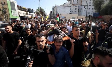 ‘We are the resistance’: show of defiance by Hamas as funeral parade ...