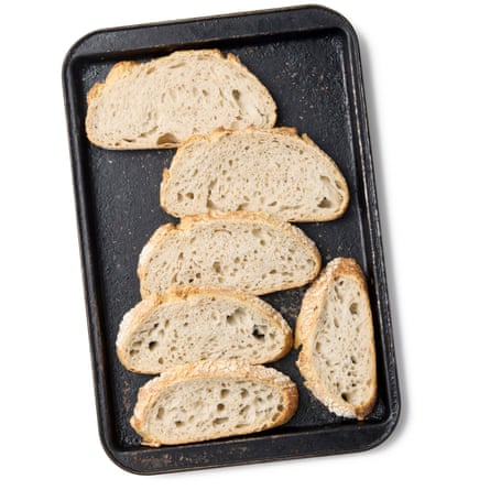 Felicity Cloake’s strata – sliced bread on a baking tray