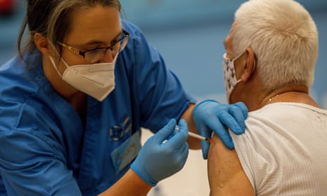 A nurse administers a vaccine booster in Cwmbran, Wales.