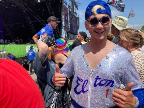 Elton John fan Thomas Lewis shows off his Elton baseball jumpsuit at Glastonbury 2023.