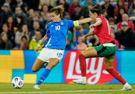 Cristiana Girelli prepares to curl the ball around Diana Gomes and put Italy 1-0 up.