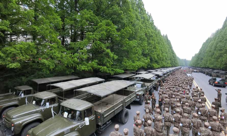 A photo from North Korea’s official Korean Central News Agency on 17 May shows officers of the military medical field of the Korean People’s Army going to supply medicines.