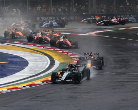 George Russell leads the field into turn one at the start during the sprint race.