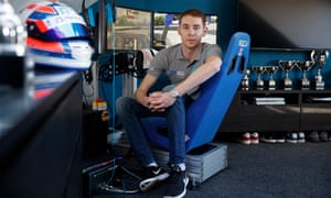 Graham Carroll, a sim-driver who competes in races from the rig set up in his bedroom, poses for a portrait in Musselburgh.