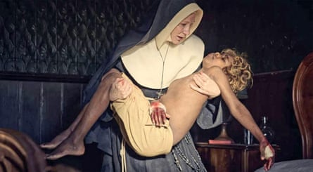 Blanchett in a nun’s habit carries Reid in her arms