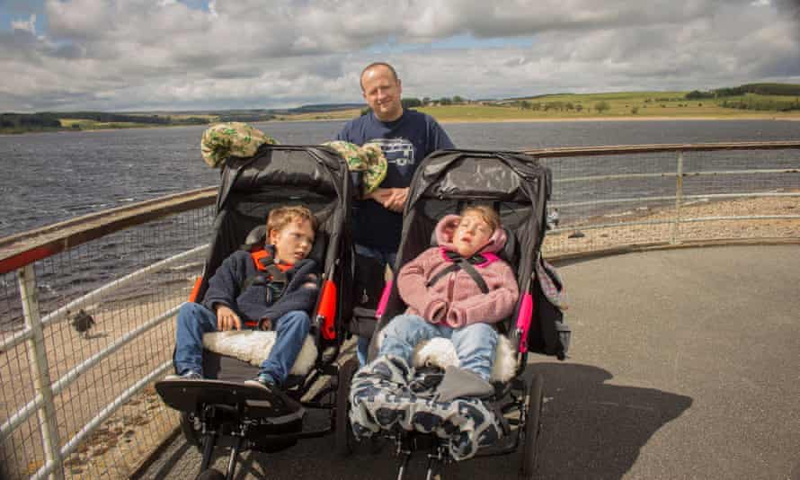Paul with his twin son and daughter.