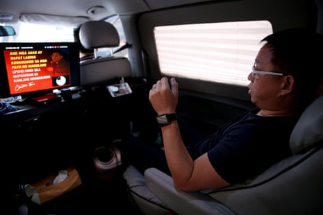 Ferdinand Tan, 53, wealth coach and motivational speaker, rehearses his lines in his van while on his way to a speaking engagement in Cainta city