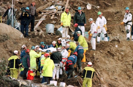 Stuart Diver, a ski instructor, is carried on a stretcher after being pulled from the ruins of two ski lodges, destroyed by a landslide on 30 July, in the alpine-style ski resort of Thredbo in the Snowy Mountains 02 August.