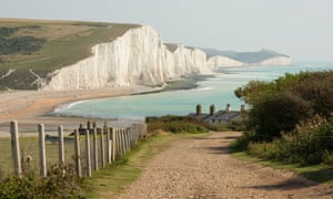 View towards the Seven Sisters chalk cliffs and Beachy Head from Seaford Head. East Sussex, England