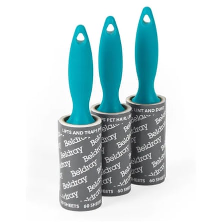 Three lint rollers with turquoise handles. On a white background.