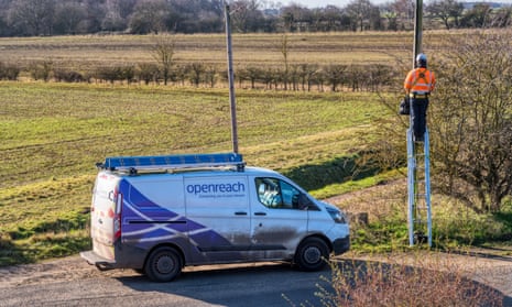 BT Openreach engineer up a pole working on a line in rural Norfolk countryside