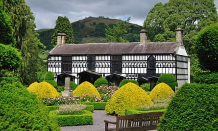 Plâs Newydd, amid beautiful gardens with topiary.