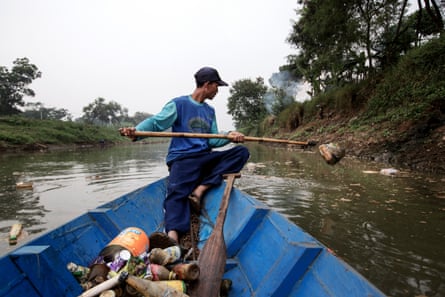 ‘Scavenger’ Mr Iwan, 34, collects recyclable material along the Citarum.