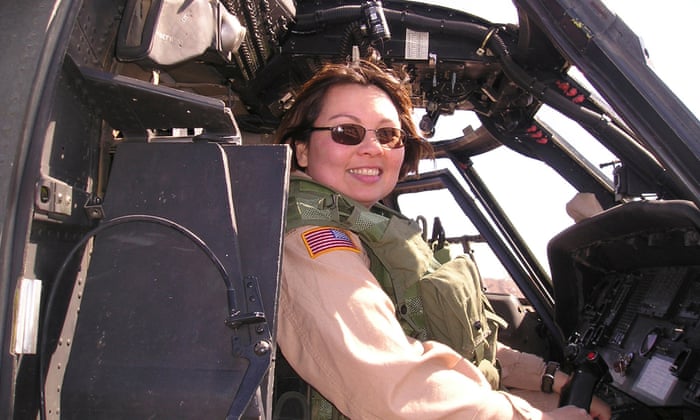 This photo provided by Tammy Duckworth shows Duckworth serving with the Illinois Army National Guard, sitting in a helicopter during her tour of duty in Iraq. (AP Photo/Tammy Duckworth, HO)