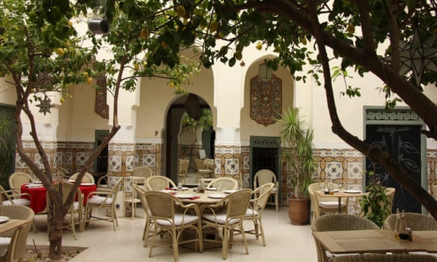 Courtyard setting for tables and chairs at Limoni restaurant in Marrakech, Morocco.