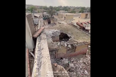 A hole on the roof of a building damaged by a reported US strike.