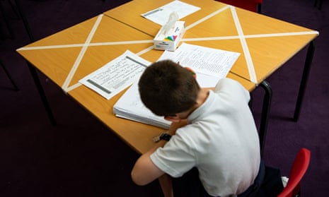 A child studies at a marked table in a Worcester primary school during the coronavirus pandemic.