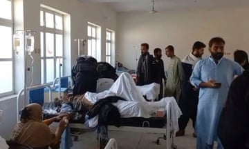 Injured people are treated at a hospital in Mastung, near Quetta, Pakistan, after an explosion