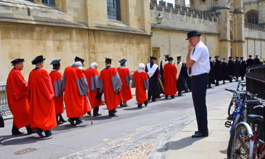 An Oxford University procession with a porter in the foreground.