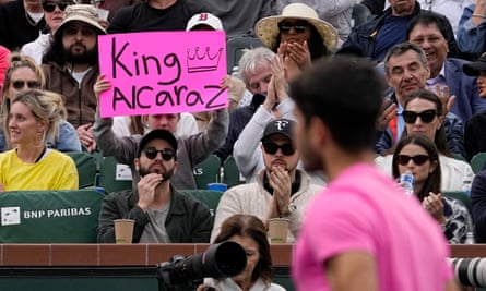 A fan holds up a sign for Carlos Alcaraz at Indian Wells in March
