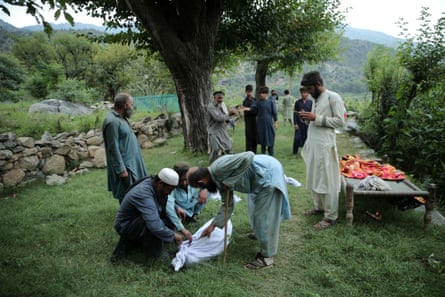 People bury earthquake victims in Kunar, Afghanistan.