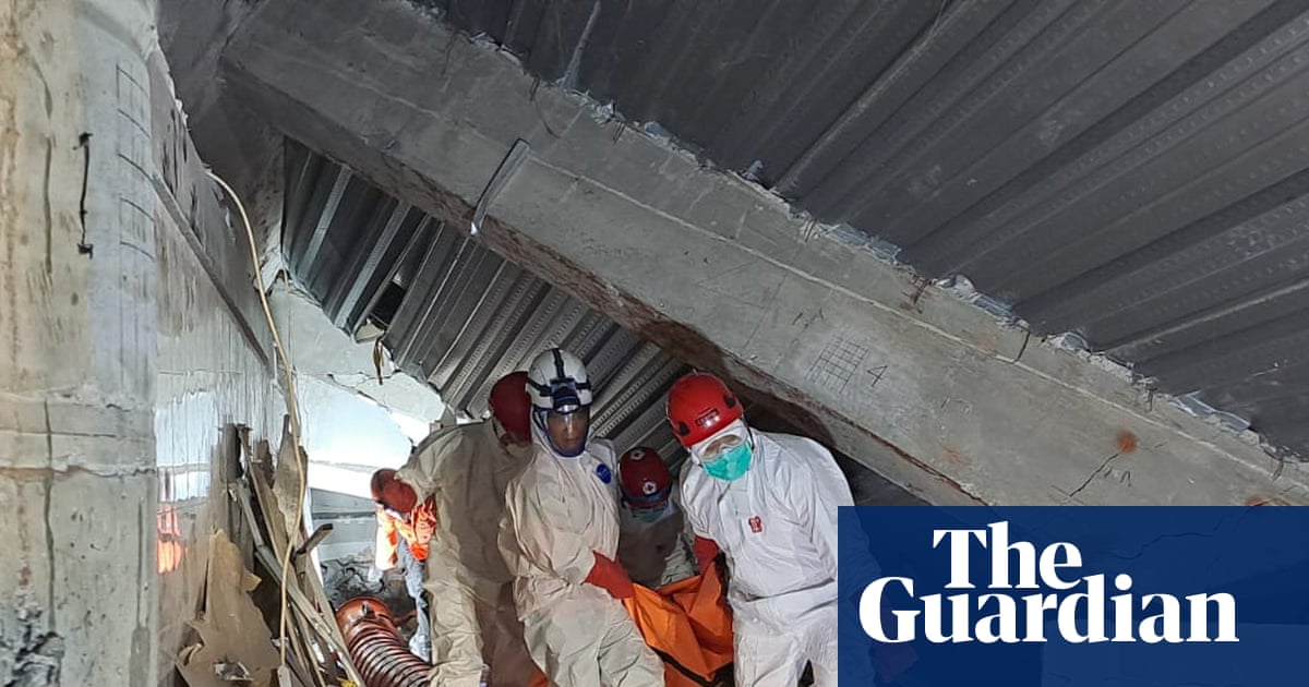 Indonesian school collapse: death toll rises to 14 as crews pull more bodies from rubble