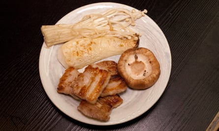 ‘We dip them in sesame seed-spiked soy and add them to the grill where they caramelise nicely’: mushrooms with pork belly.