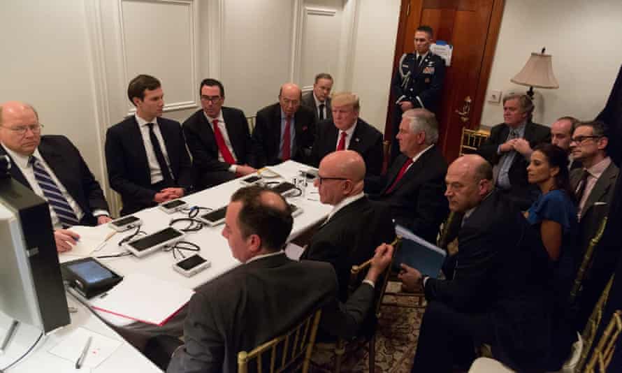 Kushner sits at the table, to the president’s left from the camera’s perspective. Bannon sits at his right.