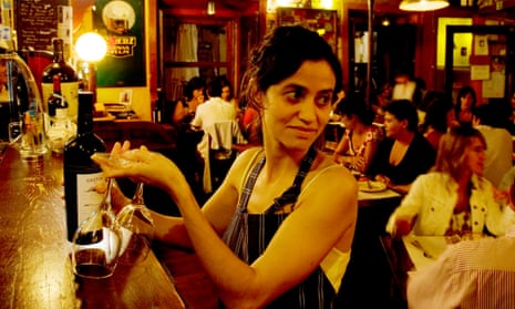 A taste of Portugal: a waitress with wine bottle and two glasses in Lisbon.